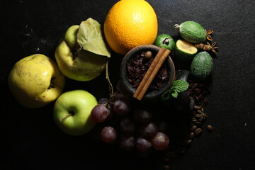 bowl of tobacco for hookah. smoking shiisha. berries and fruits on a dark background