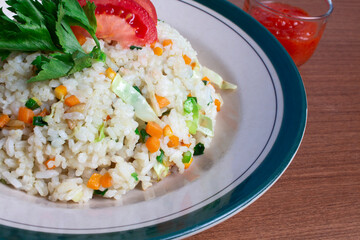 leyat fried rice with red tomato topping. Indonesian traditional cuisine