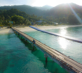 Drone shot of jetty scenery by the coast at Tinggi Island or Pulau Tinggi in Mersing, Johor, Malaysia