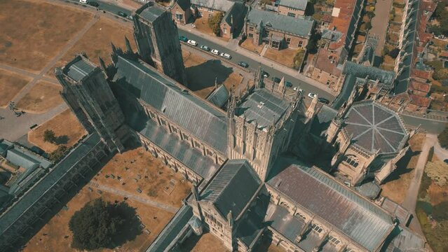 Aerial drone shot of historic Anglican cathedral in city of Wells, Somerset, UK