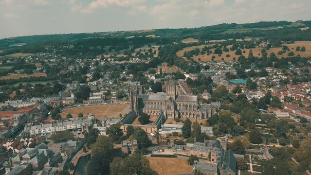 Aerial drone shot of historic Anglican cathedral in city of Wells, Somerset, UK