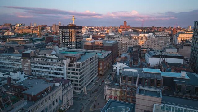 Day to night sunset time lapse of buildings and streets city view in Liverpool, England