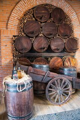 Wine Barrels, Bottles and Cart
