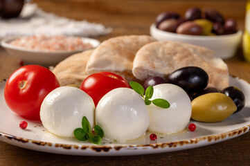 Labneh - yogurt balls with tomatoes, olives, pita and oregano