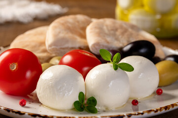 Labneh - yogurt balls with tomatoes, olives, pita and oregano. 
