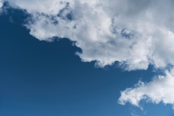 White clouds against blue sky.