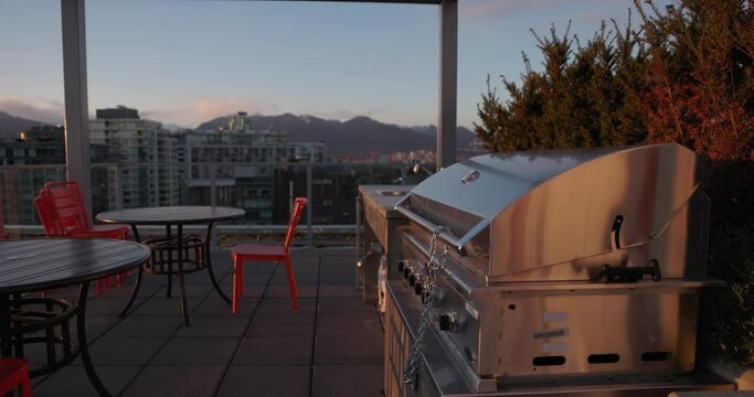 Barbecue locked up on top of condo apartment roof - shared amenities