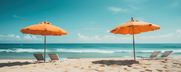 beach chairs and umbrellas on a tropical white sand beach