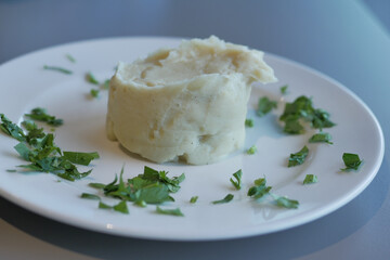 Mashed potatoes in bowl on wooden rustic table