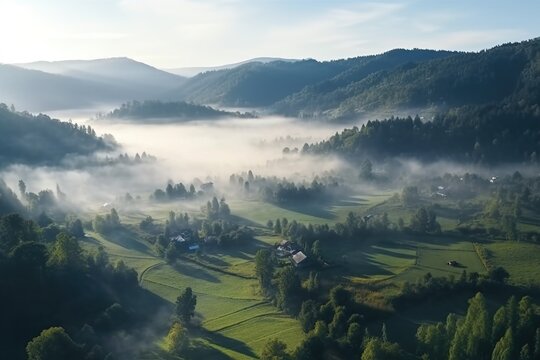 mountain valley in morning mist view from above