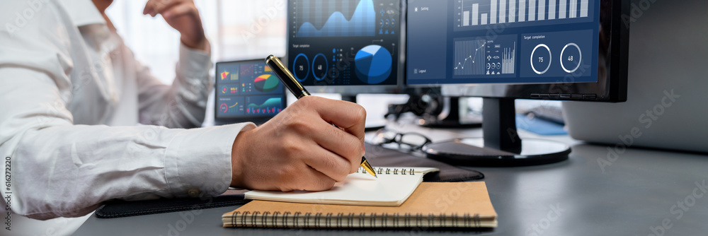 Poster analyst working on data analysis or bi dashboard on computer monitor. businessman analyzing financia