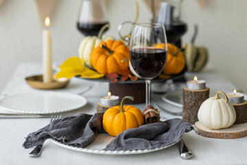 Idea for a beautiful autumn setting for thanksgiving family dinner or wedding. Orange pumpkin as...
