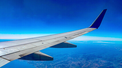 Wing of a frozen airplane flying over the Sea of Cortez and the Pacific Ocean, in the Mexican state of Baja California, in a landscape that combines the beautiful blue of the sky and the sea. Aircraft