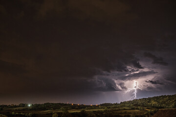 Obraz premium Storm clouds and lightning in the night sky