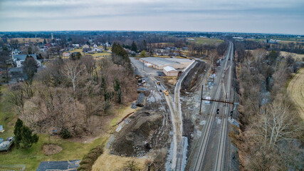 An Aerial View of a Steam Locomotive Moving Freight Cars Around in a Freight Yard to Organize a Freight Train on a Sunny Day