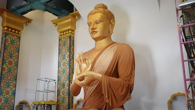 statue of Buddhist god inside of Great Stupa of Dharmakaya