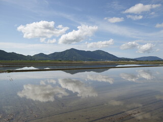 Paddy fields and mountains before rice planting