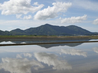 Paddy fields and mountains before rice planting