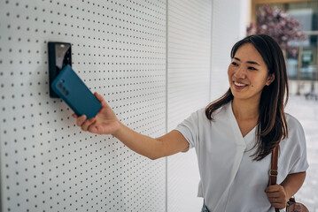 Woman with badge card near office door