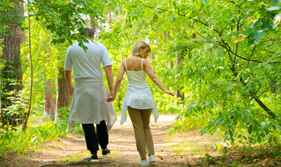 happy couple in love resting in the forest park