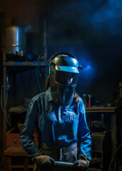 Woman with welding helmet on her head in a workshop. Female welder, workplace gender equality. Generative AI