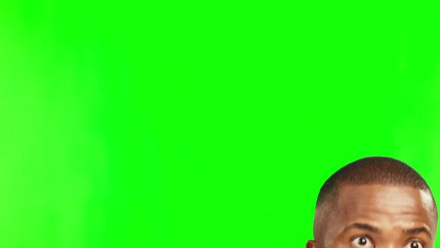Green screen, curious and black man search or peeking to discover, explore and isolated in a studio background. Thinking, casual and sneaky young person looking for adventure or notification