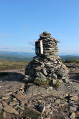 On top of a mountain, a cairn, a place of power in the mountains of Norway