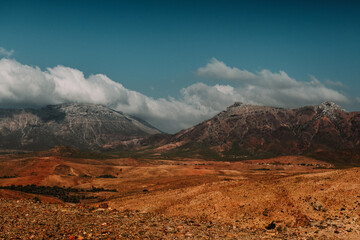 Dramatic mountain landscape under cloudy skies in Socotra, Yemen.
