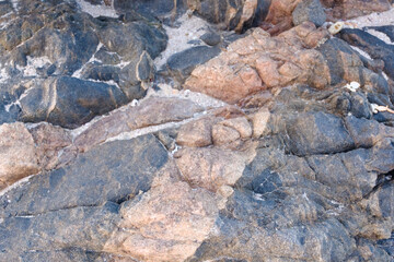Close-up of colorful rock formations at Arher Beach in Socotra, Yemen, highlighting the unique geological features.