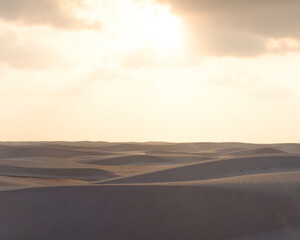 Sunrise over the tranquil Zahek Dunes in Socotra, Yemen, with soft light illuminating the sand.