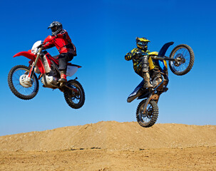 Motorcycle jump, sport and action with stunt and energy on off road track, transportation and...