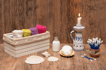 Bath of a spa on the beach with towels, cotton, cream.