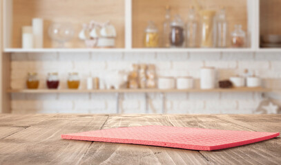  Wooden kitchen countertop with red napkin