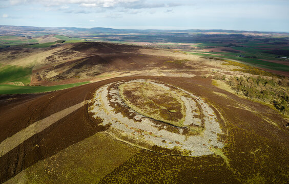 White Caterthun. Dry stone wall prehistoric hillfort, possibly Pictish, on earlier Bronze or Iron Age occupation site. View NE to Brown Caterthun