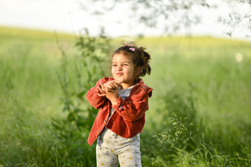 little girl playing and having fun by the river