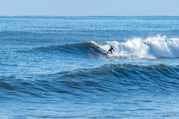Man surfing atlantic ocean waves