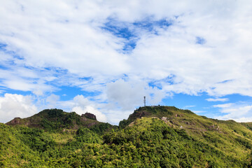 Fototapeta na wymiar Green mountains and beautiful cloudy sky under blue sky.