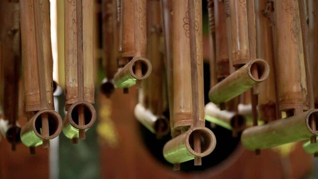 Angklung musical instrument hanging arrangement. Indonesian traditional musical instrument made from bamboo