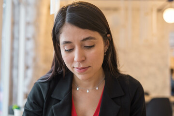 attractive female model, portrait of young latin woman with black hair, skin texture in studio, beauty closeup to face