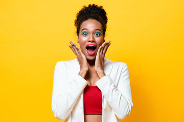 Fashionable African-American woman with colorful makeup expressing shocked excited feeling with...