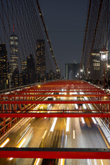 Fototapeta na wymiar Long Exposure of traffic at night on the Brooklyn Bridge