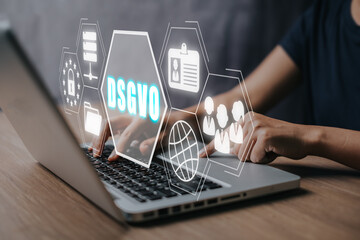 DSGVO Basic Data Protection Regulation Concept, Person working on laptop computer with DSGVO icon...