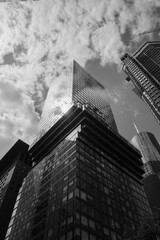 Black and white tone dramatic sky, Low angle view of modern skyscrapers, High rise building in downtown district of Frankfurt, Germany. 