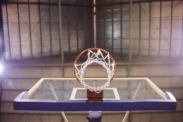 Close-up down view of basketball hoop indoor