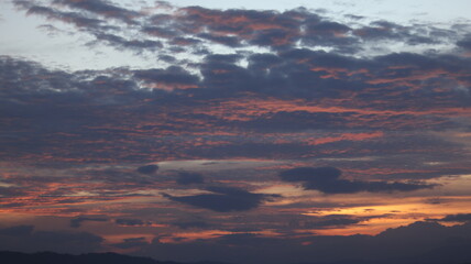 Fototapeta premium Beautiful sunset sky with clouds background. Sky with clouds and sun