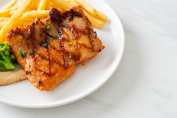 grilled chicken steak with potato chips or french fries