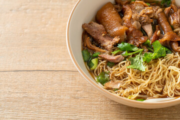 Stewed pork leg noodles in brown soup