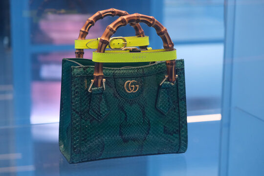 Shanghai,China-June 3rd 2023: close up Gucci python diana bag with bamboo handle and leather belts.