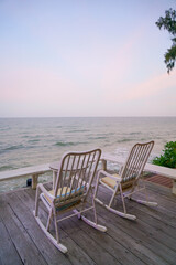 empty chair on balcony with sea background