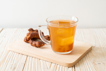 Delicious sweet drink tamarind juice and ice cube